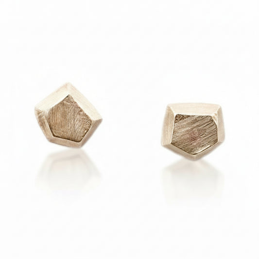 Pair of tiny 14k solid yellow gold geometric stud earrings by Adeline Jewelry with faceted, angular surfaces and a minimalist design.
