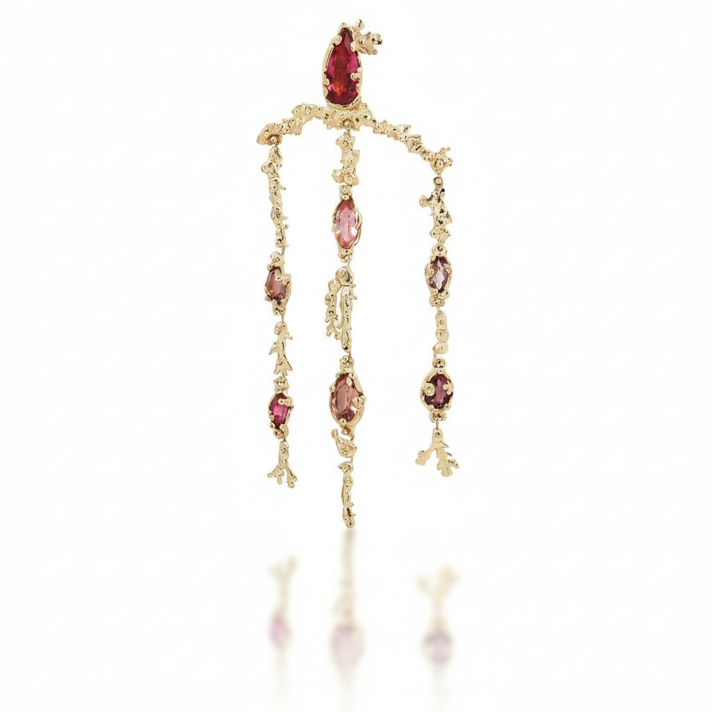Full view of the pink tourmaline chandelier earring featuring a pear-cut tourmaline and cascading pink gemstones in a hand-carved 14k yellow gold coral-inspired design.