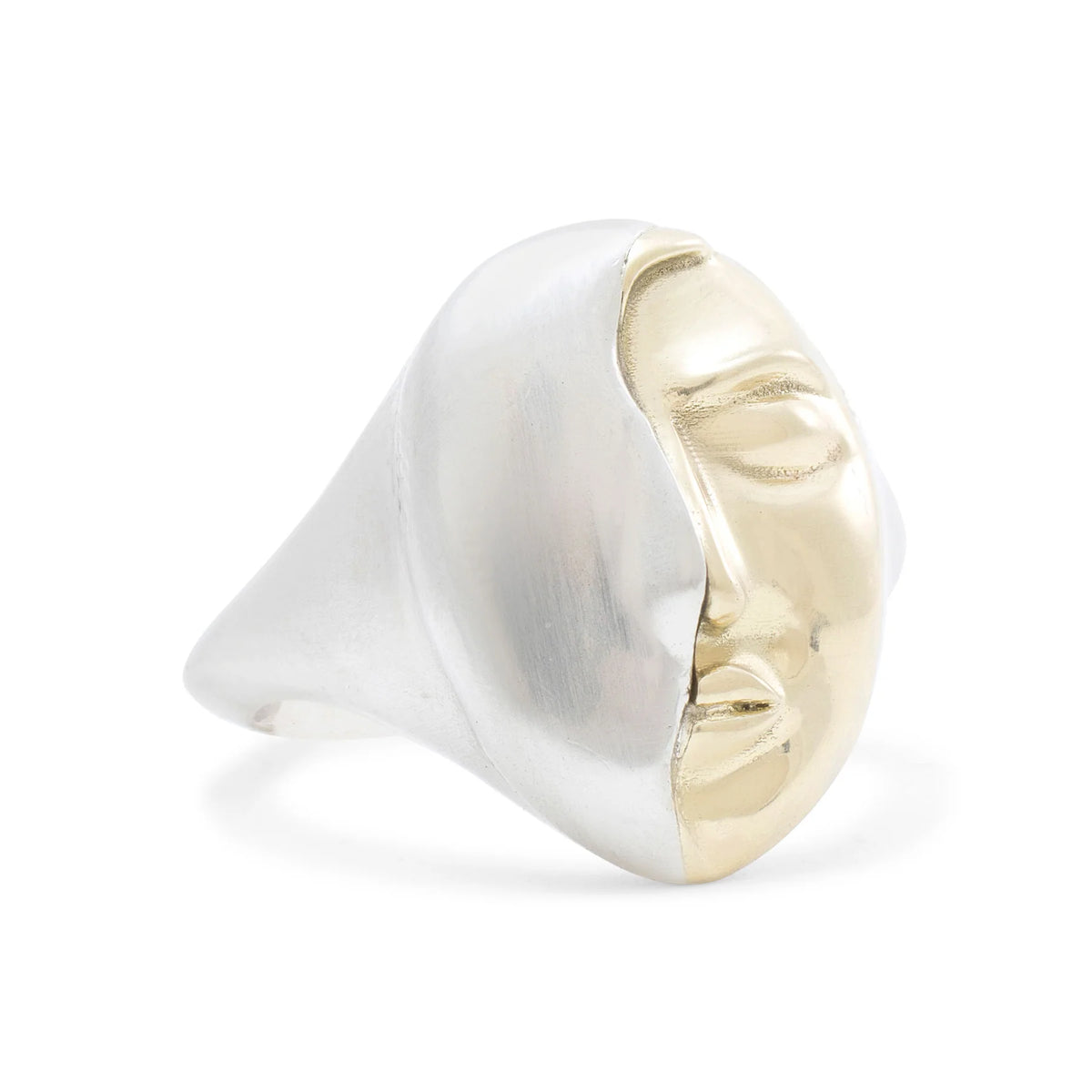 Angled view of the Truth Ring showing its raised sterling silver form and contrasting 14k yellow gold sculptural face.