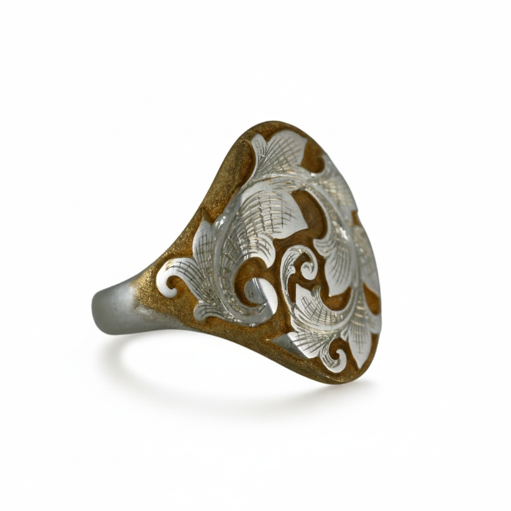 Two-tone acanthus engraved signet ring on white background – silver and gold scroll design.