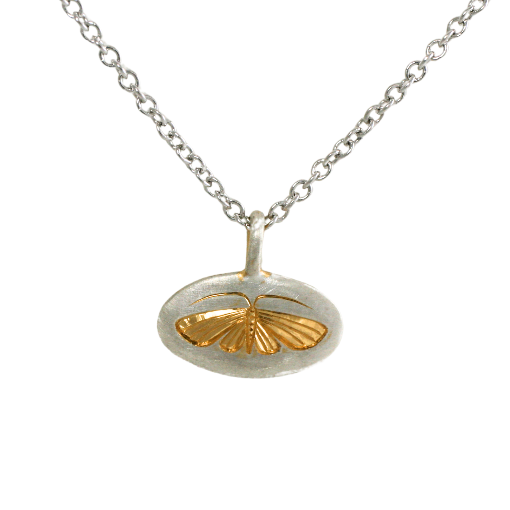 Two-tone house moth pendant with a sterling silver base and 14k gold engraved moth, displayed on a chain against a white background.