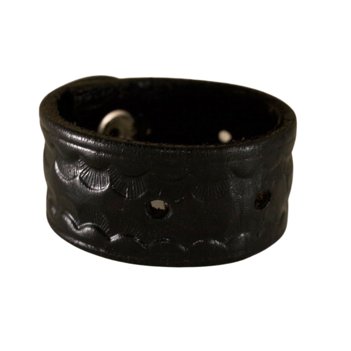 Vintage black leather cuff bracelet featuring metal studs, distressed leather texture, and an adjustable snap closure.