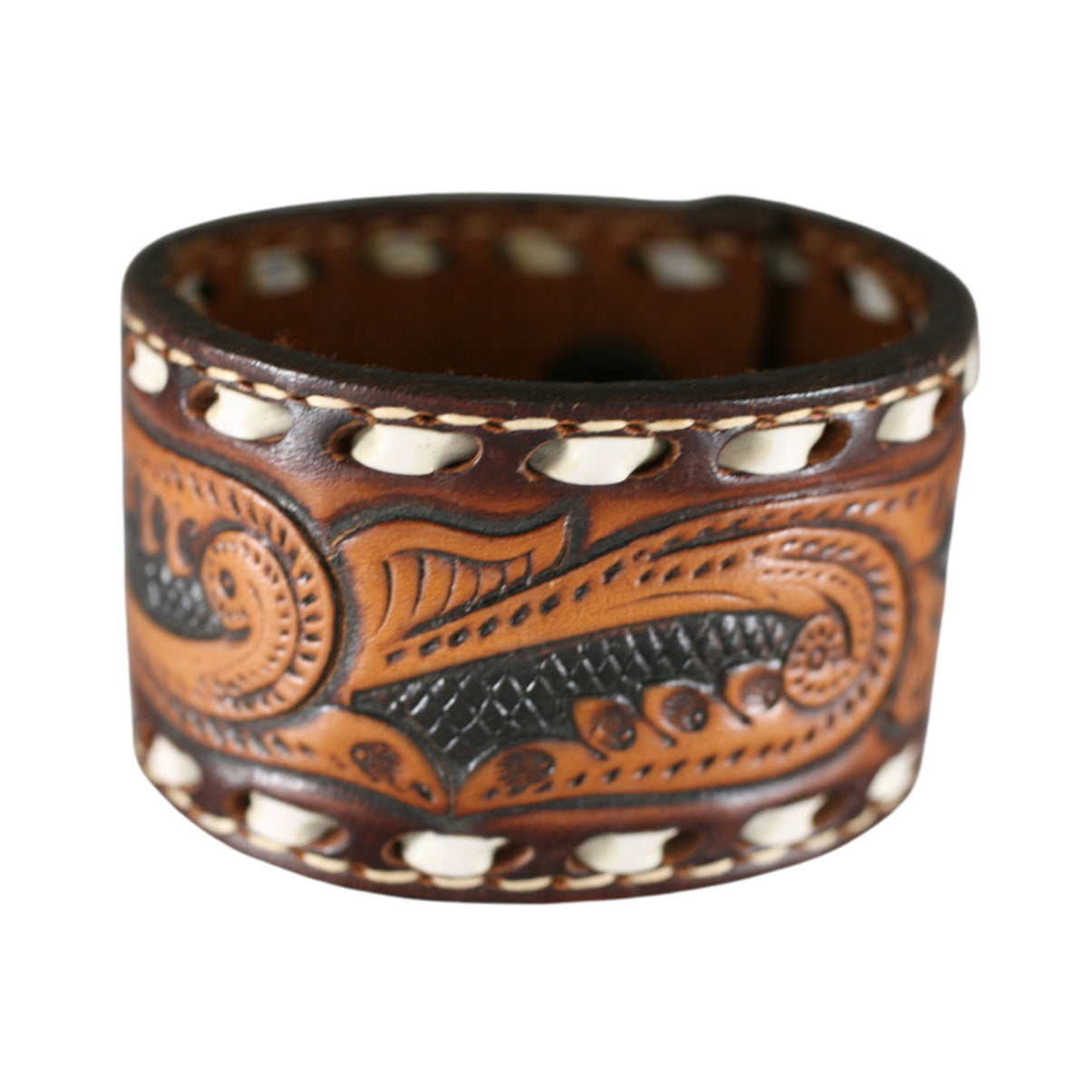 Wide vintage brown leather cuff bracelet featuring ornate Western scrollwork, decorative edging, and antique patina.