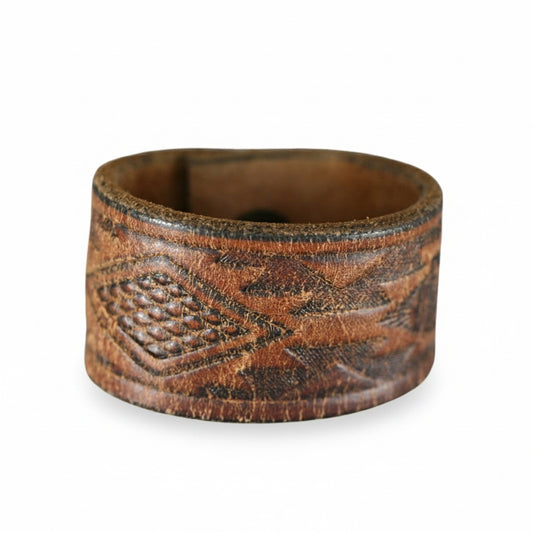 Vintage brown leather cuff bracelet by Kelly Horrigan Handmade, featuring distressed patina and embossed Western-inspired patterns.