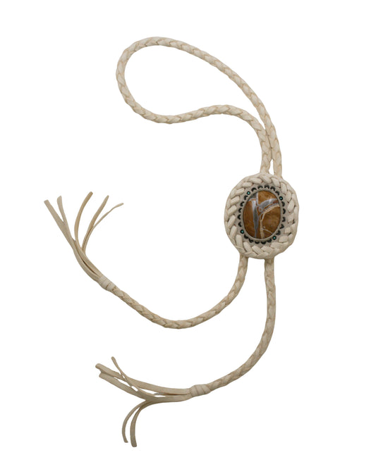 Hand-tooled leather bolo tie featuring a Willow Creek jasper stone, handmade by Kelly Horrigan at Teko Gallery.