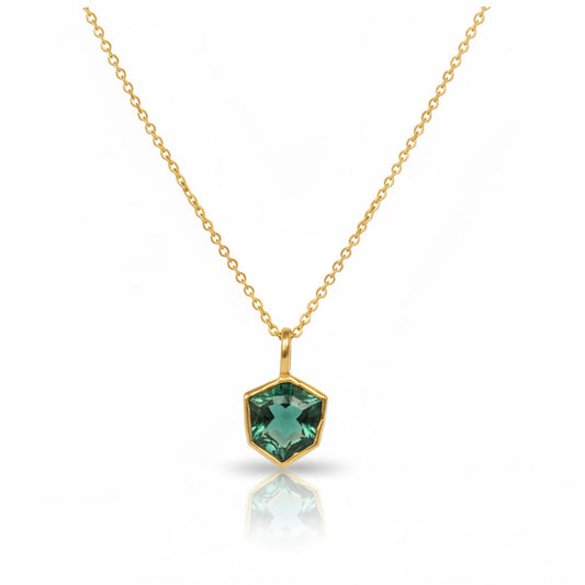 Michaela Farkasovska natural Zambian emerald pendant bezel set in 22k yellow gold with an 18k white gold backing, suspended from an 18k gold chain.